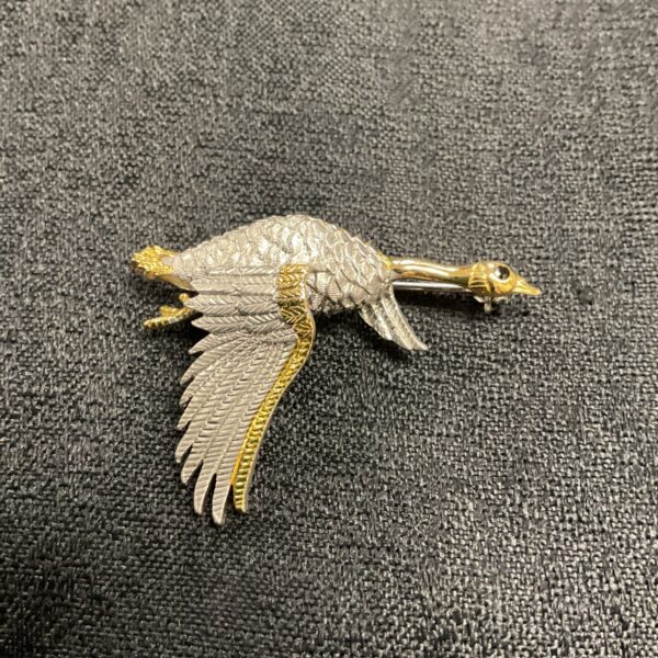 Vintage silver and gilded goose brooch signed StoneX.