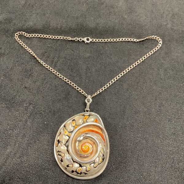 Vintage Italian silver pendant with a natural snail shell.