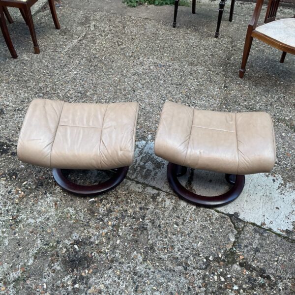Vintage Stressless footrests, a pair of mid-century modern footstools.