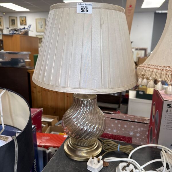 Vintage table lamp with glass shade and brass details.