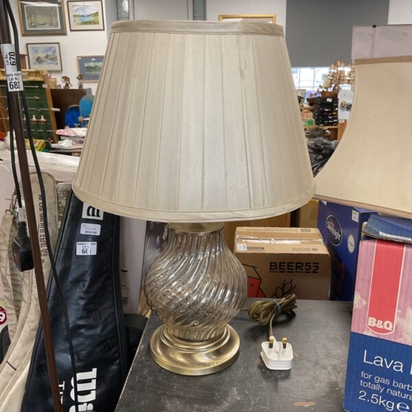 Vintage table lamp with a pleated shade and brass base.