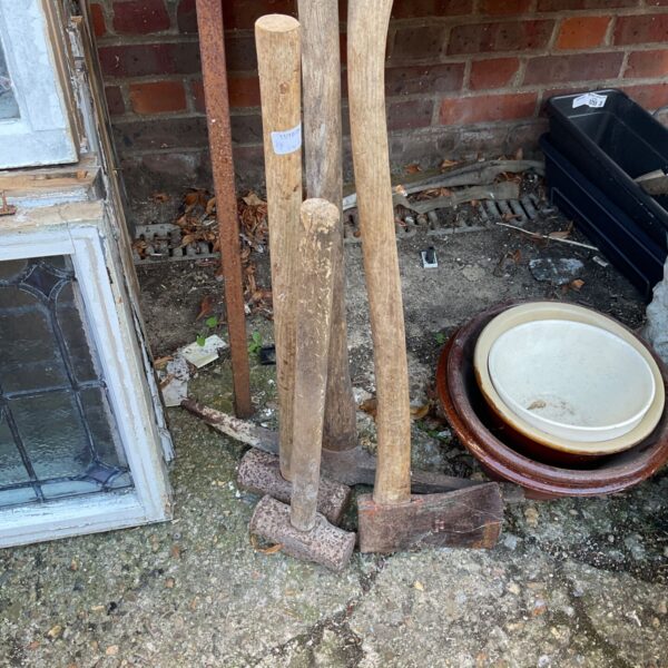 Vintage tools lot including sledge hammer, pick and axe.