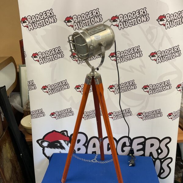 Vintage tripod spotlight lamp with wooden legs.