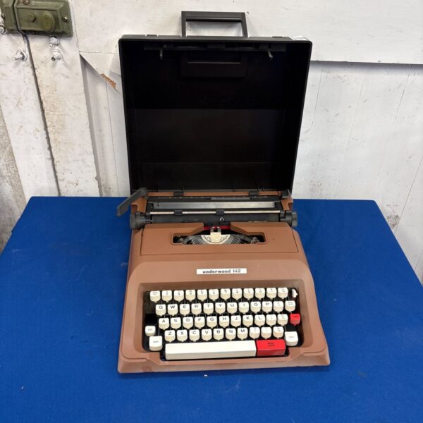 Brown vintage Underwood 142 manual typewriter with open black carrying case