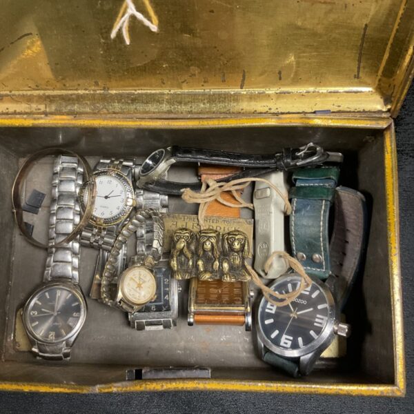 Vintage watch lot in a tin with brass monkeys.