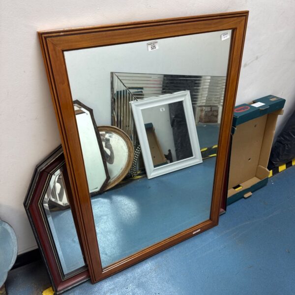 Large vintage wood framed mirror for home decor.