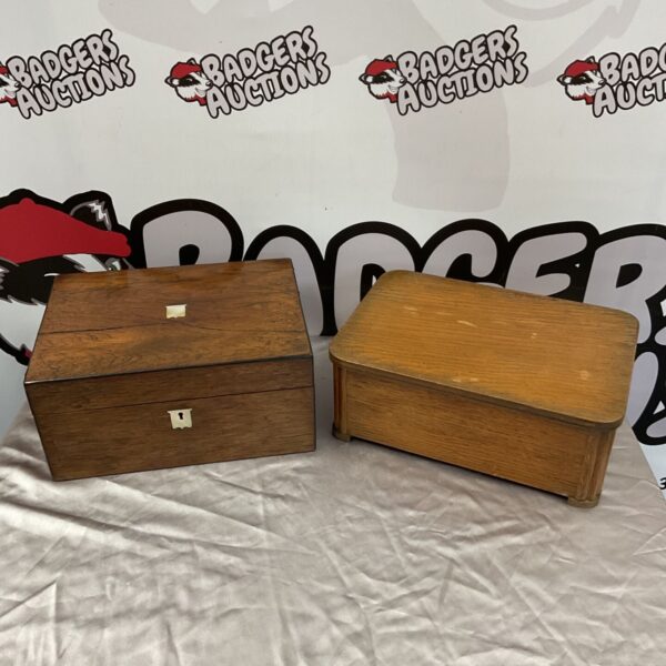 Two vintage wooden boxes with hinged lids, one dark and one oak-effect