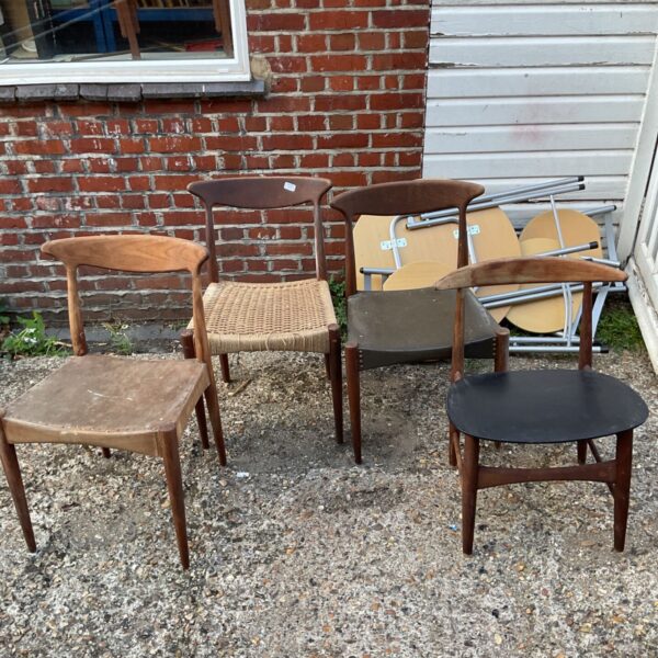 Lot of four vintage wooden chairs with woven seats.
