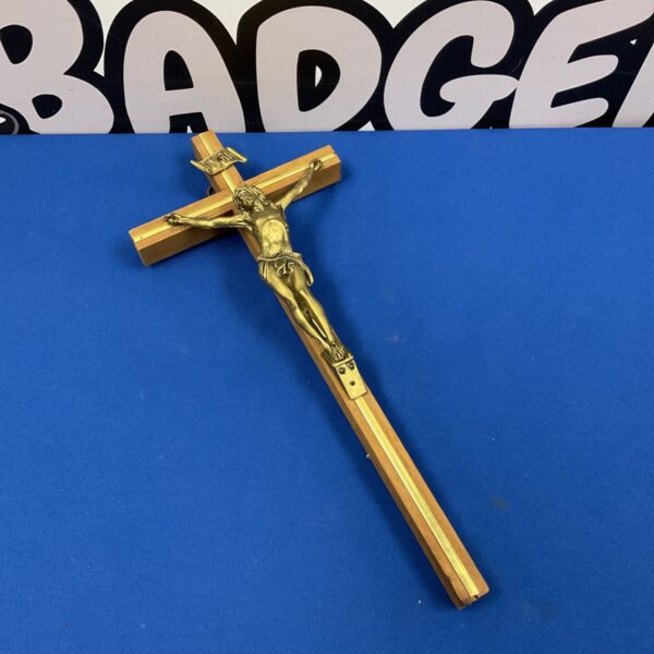 Vintage wooden crucifix with detailed brass corpus of Jesus Christ.