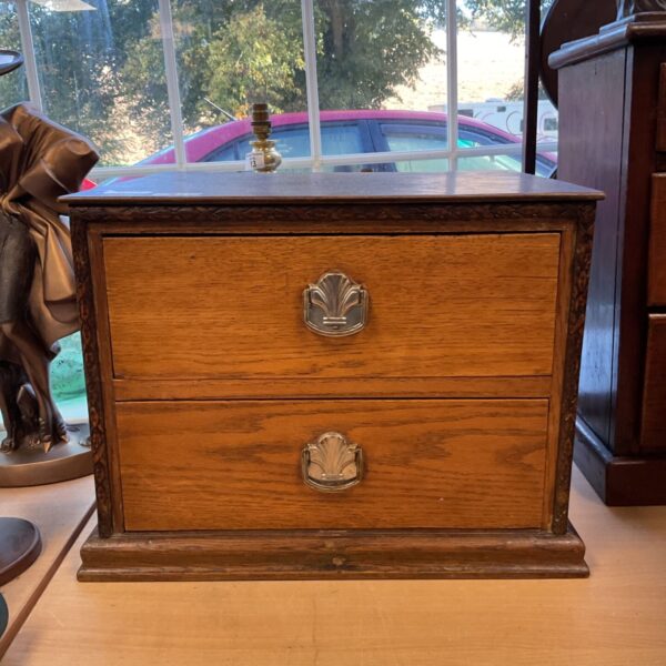 Vintage wooden desktop drawers with art deco clam shell pulls.