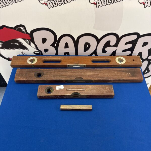 Vintage wooden spirit level with glass vial for accurate leveling.
