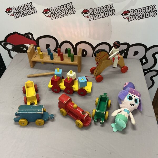 Vintage wooden children’s toys including a colourful train and building blocks.