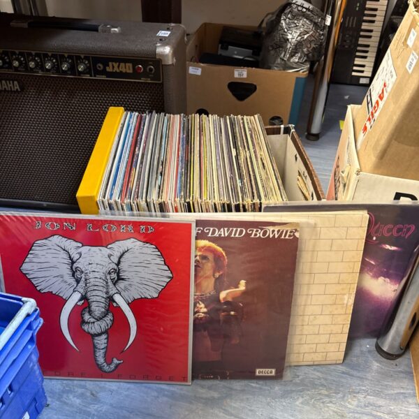 Vinyl LP collection featuring albums by Queen, David Bowie, and Pink Floyd.