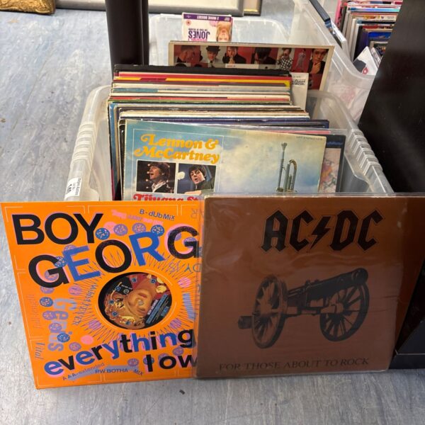 Mixed lot of vinyl records including AC DC album.