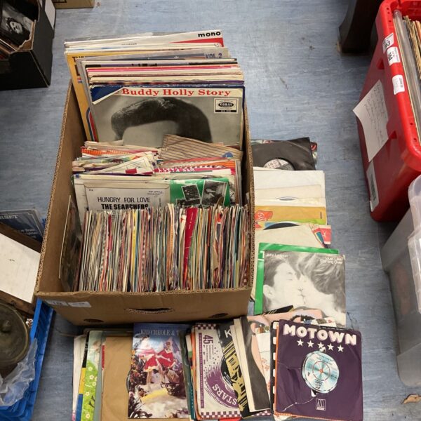Large collection of vintage vinyl records including Motown and John Lennon singles.