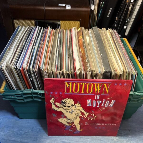 Crate of vintage vinyl records including Motown and country music.