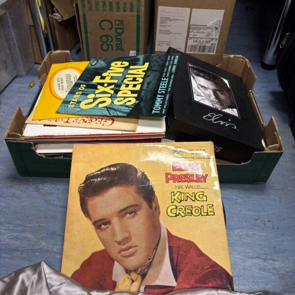Box of mixed 12 inch vinyl records including Elvis Presley.