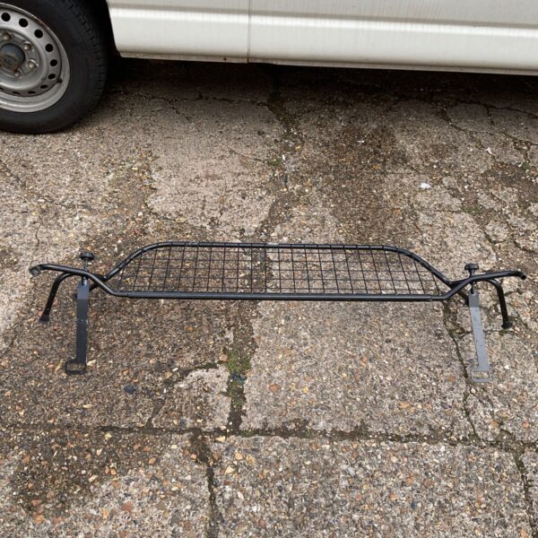Black VW car pet guard for secure pet travel.