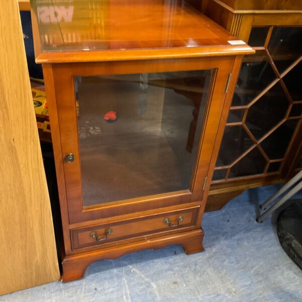 Small antique walnut display cabinet with glazed door.