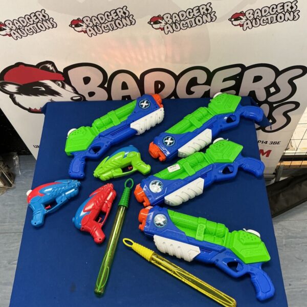 Colourful water pistols and bubble wands for summer garden play.