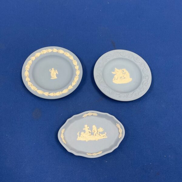 Three blue Wedgwood Jasperware trinket dishes with white classical relief decoration