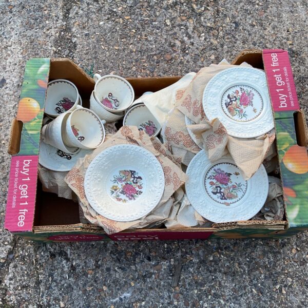 Tray of vintage Wedgwood Wellesley china dinner service pieces.