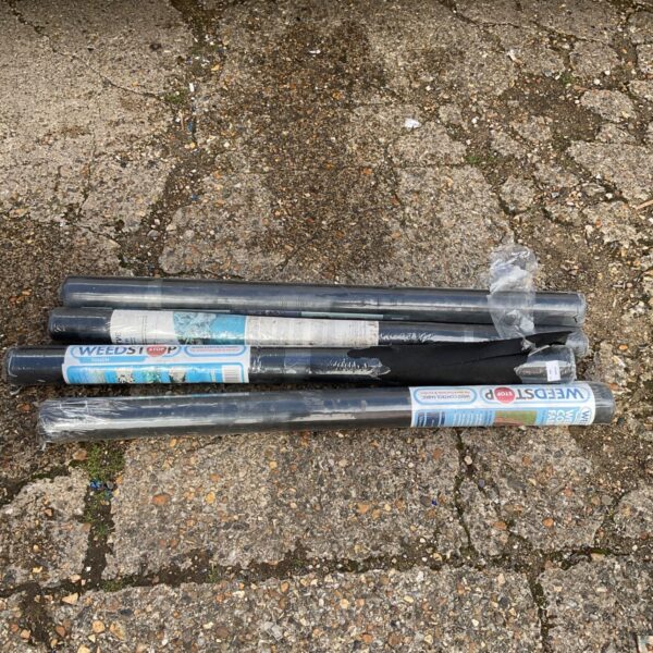 Four rolls of Weedstop weed control fabric for garden use.