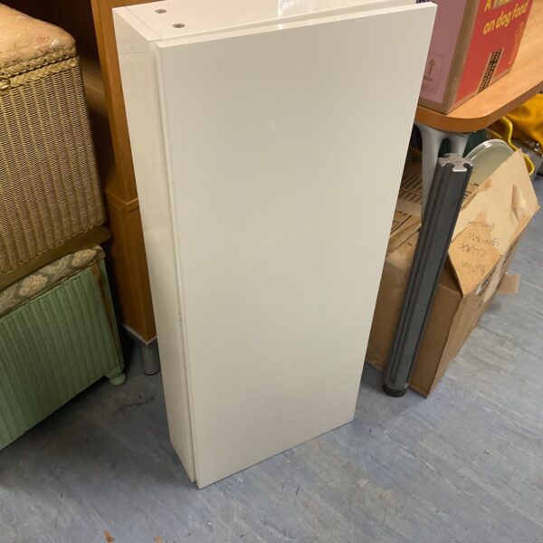 White bathroom cabinet for storage, slim design.