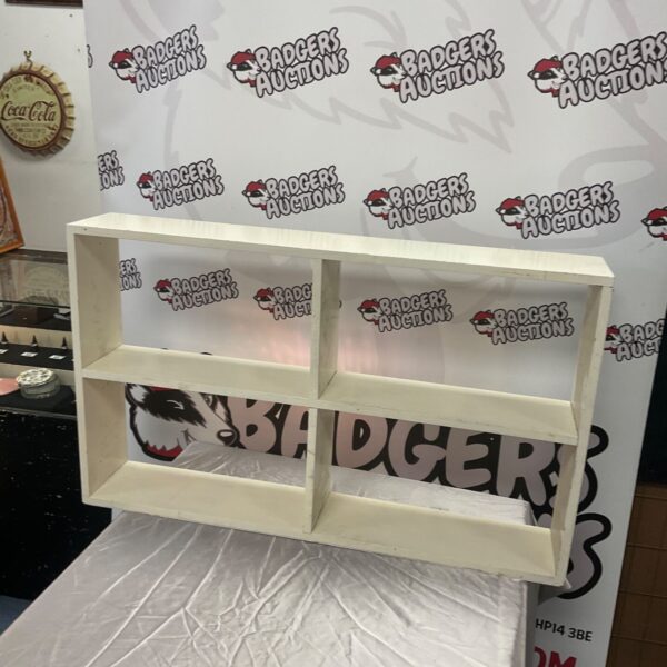 White painted bookcase with four open compartments in two tiers