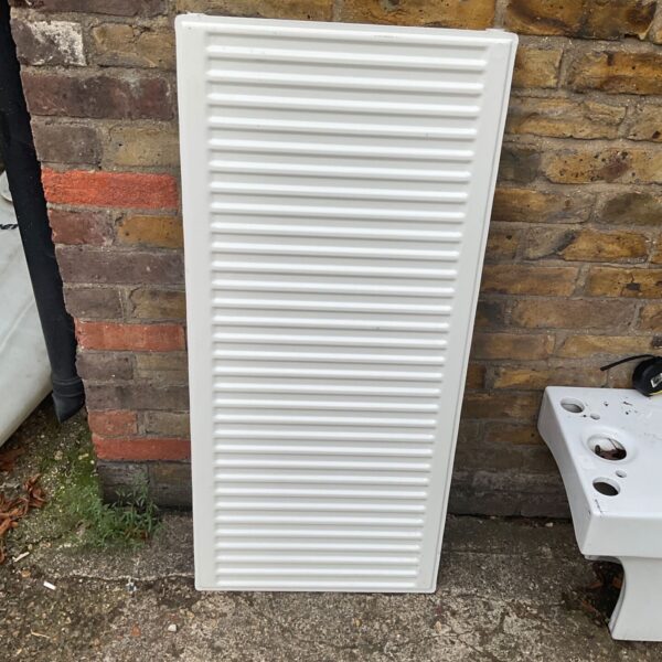 White panel radiator measuring 110x50cm for central heating.