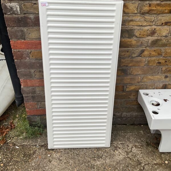 White panel radiator measuring 110x50cm for central heating.