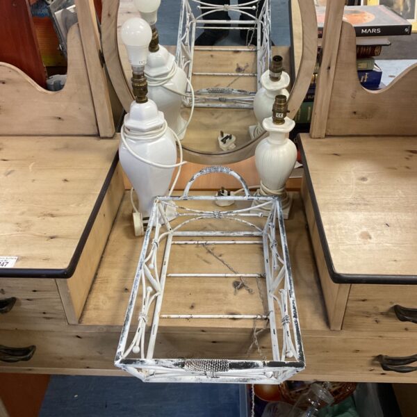 Two white urn table lamps beside a white painted metal display tray