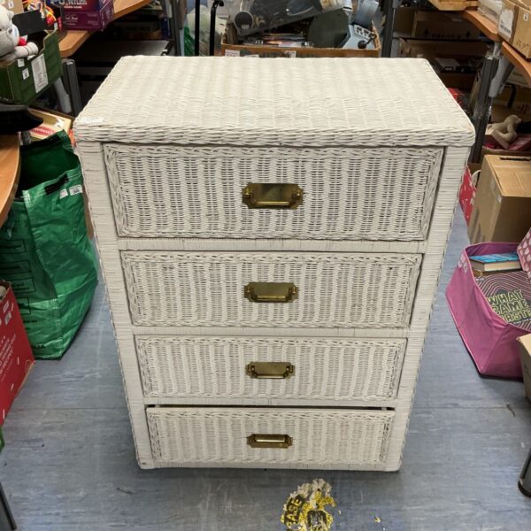 White wicker dresser with four drawers, vintage bedroom storage.