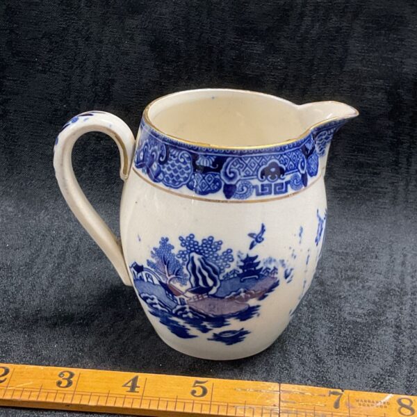 Vintage blue and white Willow Pattern creamer, collectible pottery.