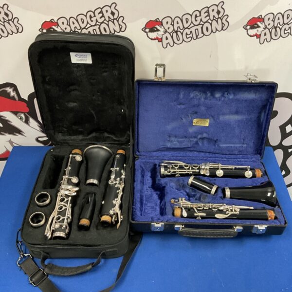 Two Windcraft clarinets dismantled in black soft case and blue-lined hard case