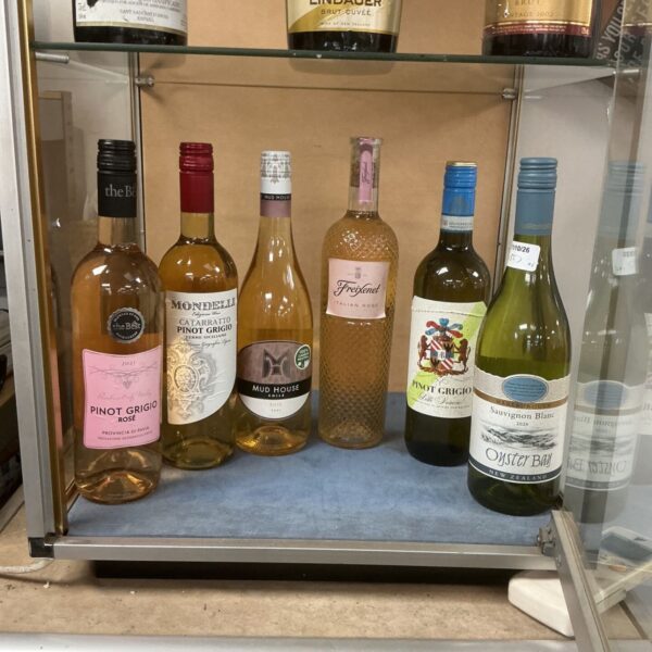 Assorted wine bottles including Pinot Grigio and Freixenet.
