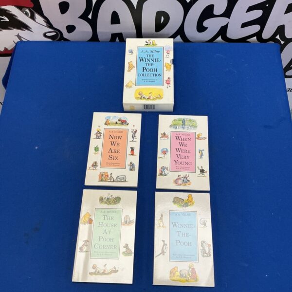 Vintage Winnie The Pooh book collection by A.A. Milne, illustrated covers.