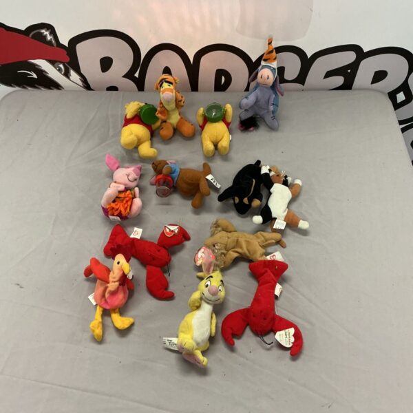Winnie the Pooh and TY Beanie Baby soft toy collection.