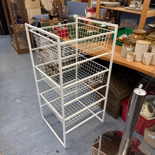 Vintage metal wire basket storage unit for home organisation.