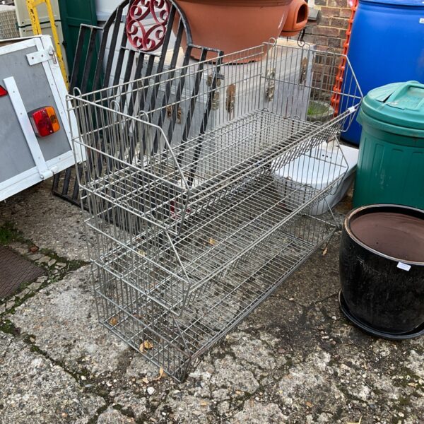 Outdoor wire storage basket, metal mesh container for garden or utility use.