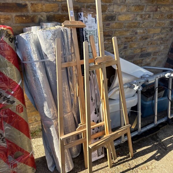 Two wooden artists easels for painting and display.