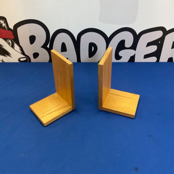 Pair of classic wooden bookends for shelf support.