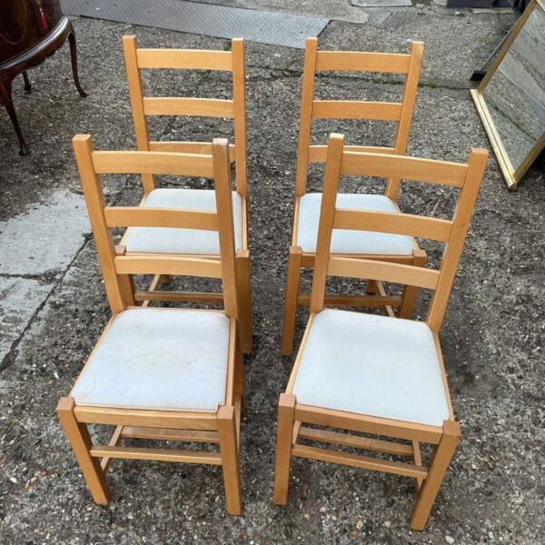 Set of four vintage wooden dining chairs for kitchen or dining room.