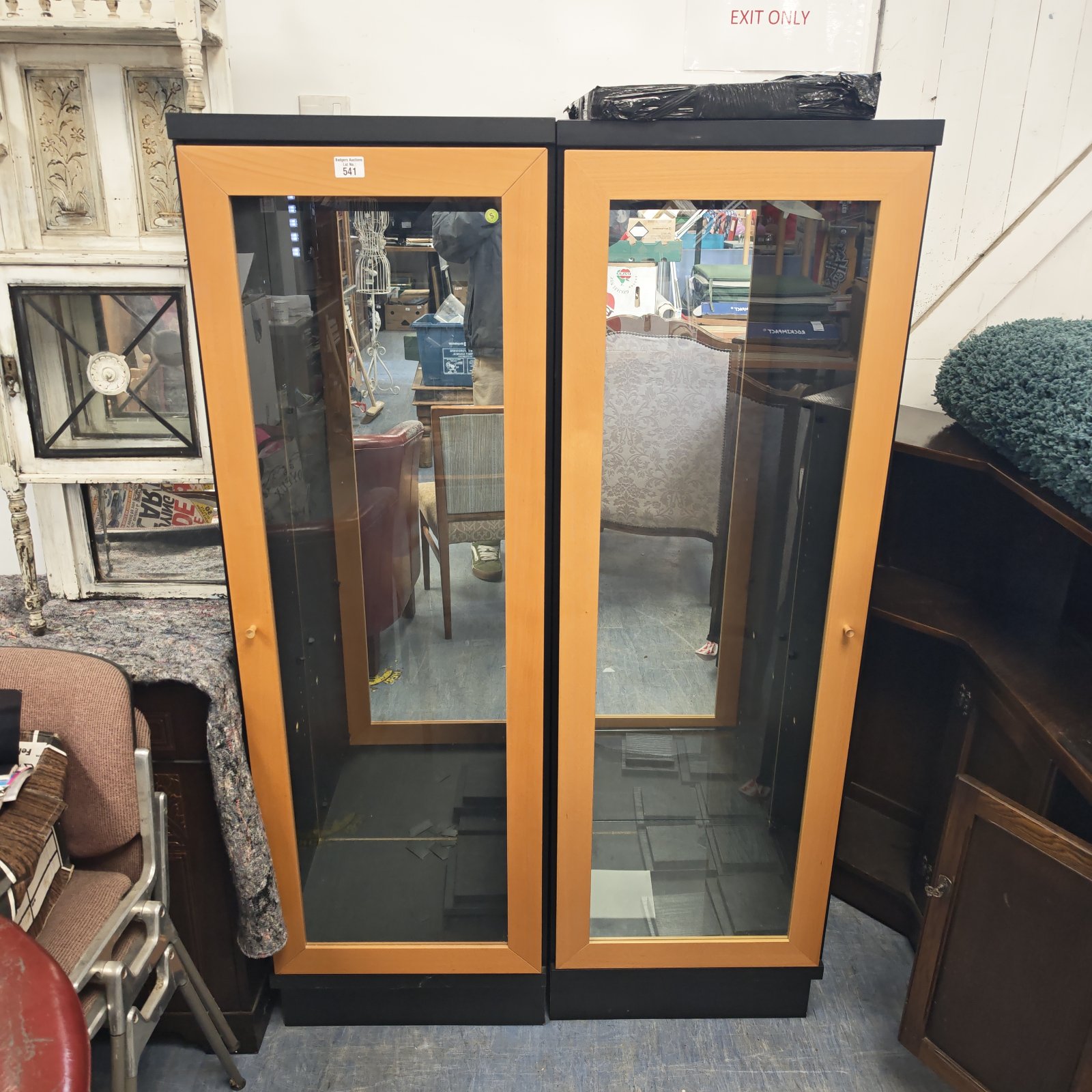 Pair of vintage wooden display cabinets with glass fronts.