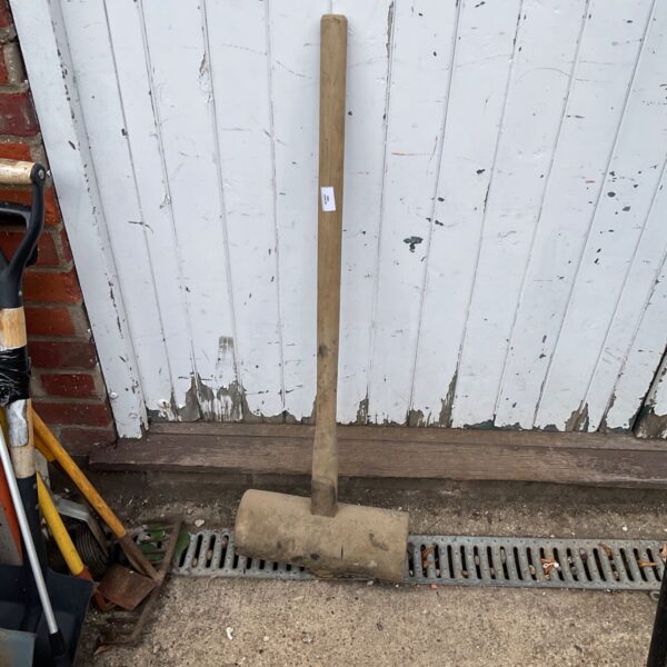 Large wooden tamper mallet, a vintage garden and DIY tool.