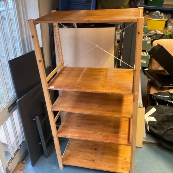 Freestanding wooden shelving unit with five open shelves and metal cross-bracing