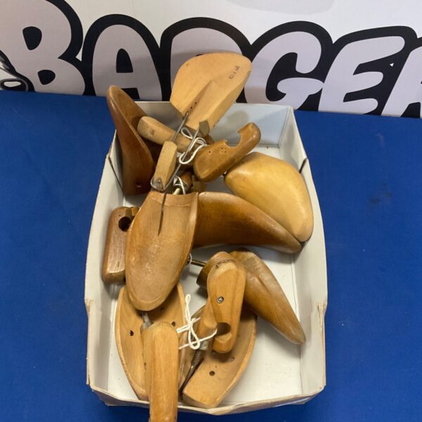 Vintage wooden shoe shapers for maintaining shoe form.