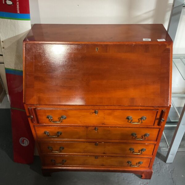 Wooden slant-front writing bureau with drop down lid and four drawers