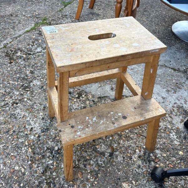 Vintage wooden step stool with three steps, rustic farmhouse style.