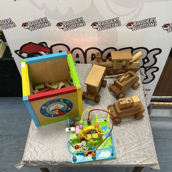 Multicoloured wooden toy chest with wooden toys and vehicles on display